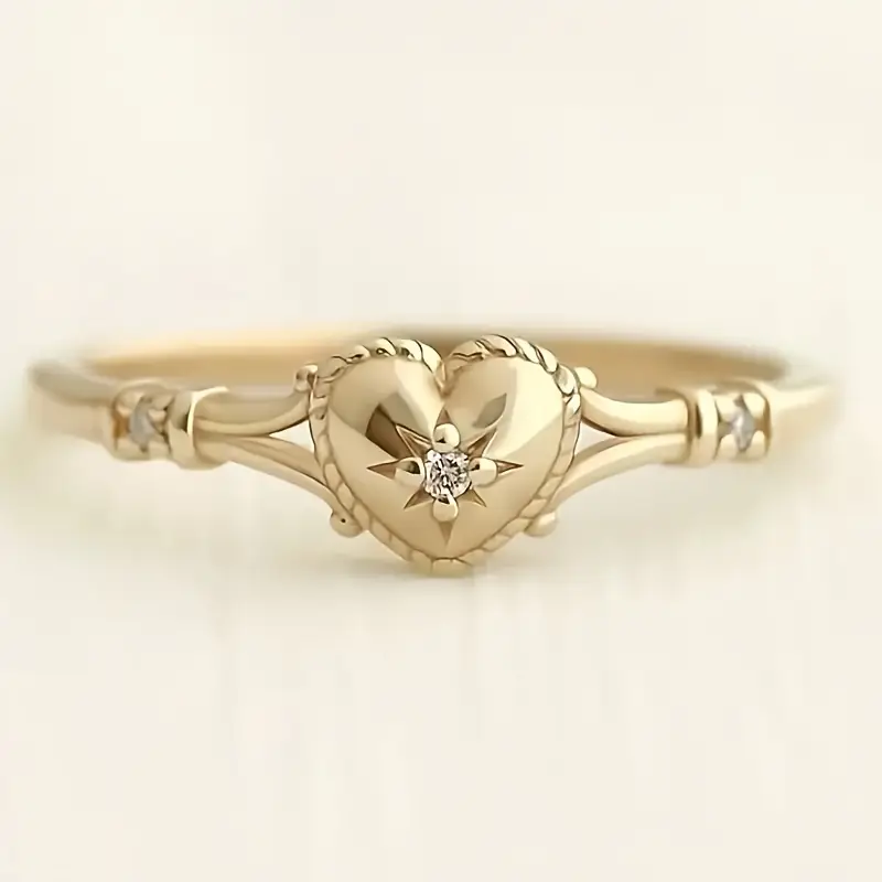 Eleganter Ring mit Herz- und Sternmotiv in Gold